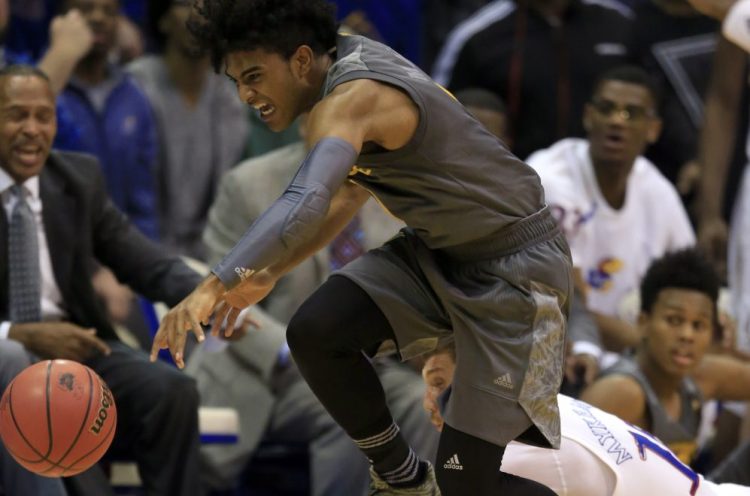 Arizona State guard Remy Martin, top, steals the ball from Kansas guard Sviatoslav Mykhailiuk, bottom, during the Sun Devils' 95-86 win Sunday in Lawrence, Kansas. It was the second straight loss for the Jayhawks.