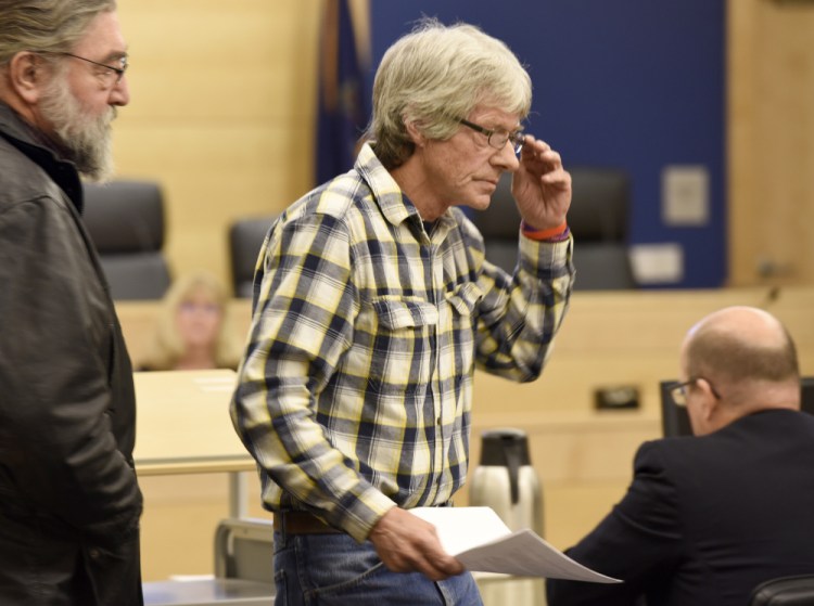 Vance Ginn returns to his seat after testifying Friday about his murdered daughter, Stephanie Gebo, during the sentencing of Robert Burton. Ginn later spoke of the need for ankle monitoring bracelets to prevent attacks by domestic violence perpetrators like Burton.