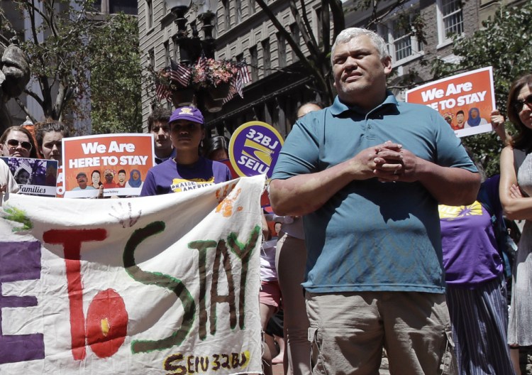 Francisco Rodriguez-Guardado, shown at a rally in Boston, says he isn't concerned about whether he'll be sent back to jail or deported after he was released Thursday. "I'm with my children," the Massachusetts Institute of Technology janitor said Friday. Rodriguez-Guardado's mother says the family is "overjoyed." 