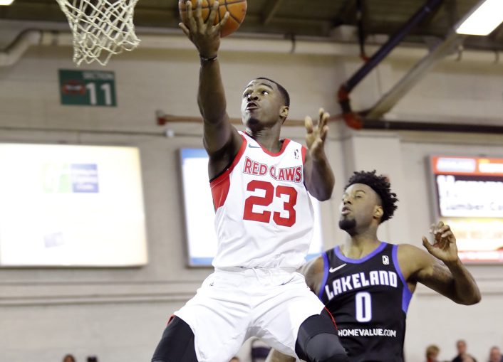 Maine's Jabari Bird takes a layup while being defended by Lakeland's Jamel Artis on Sunday at the Portland Expo. Bird scored 30 points and the Red Claws won 110-101.