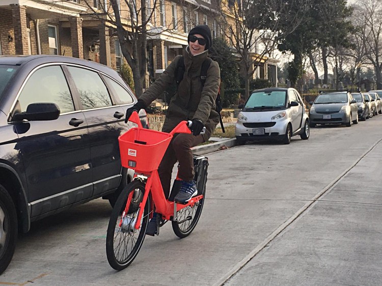 Rider plying the streets of Washington, D.C., on an electric-assisted JUMP Bike. 