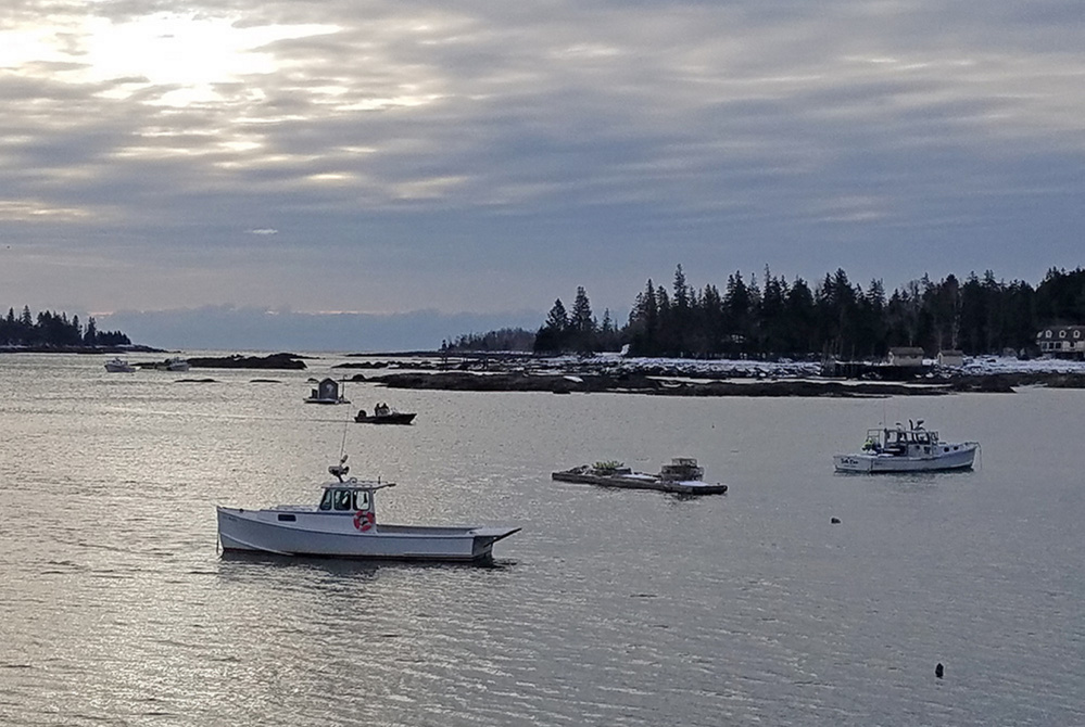 Paul Benner of Thomaston left to go clamming from the former Great Eastern Mussel Farm dock off Long Cove Road in St. George. Photo was taken Friday from the dock.