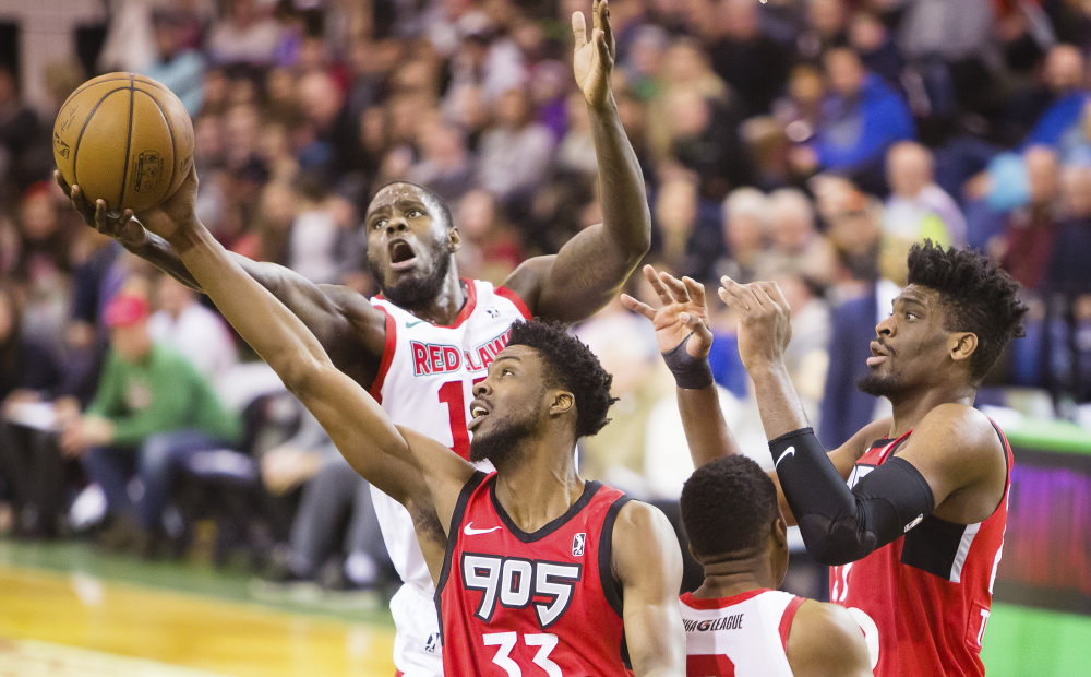 Anthony Bennett fights for a rebound with Kuran Iverson of Raptors 905 during the Red Claws' 100-93 loss Sunday afternoon at the Portland Expo. Bennett was playing his second game for the Red Claws after he was acquired in a trade in late December.