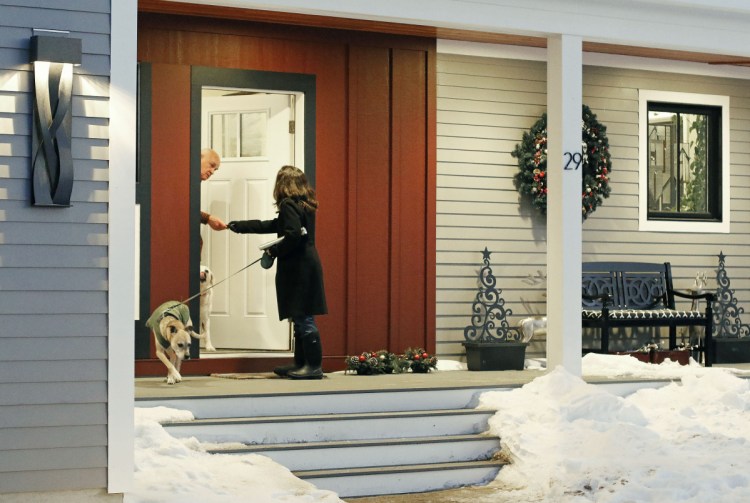 Republican candidate Allyson Cavaretta of York shakes hands with a neighbor as she begins campaigning door-to-door on Osprey Lane, introducing herself and her run for state representative. "I think, in general, women are feeling more empowered to run," Cavaretta said.