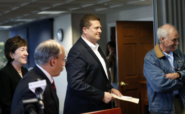 Bath Iron Works President Dirk Lesko leaves a news conference during a visit to BIW by Navy Secretary Richard Spencer in Bath on Sept. 29. Sen. Susan Collins, R-Maine, at left, follows Lesko.