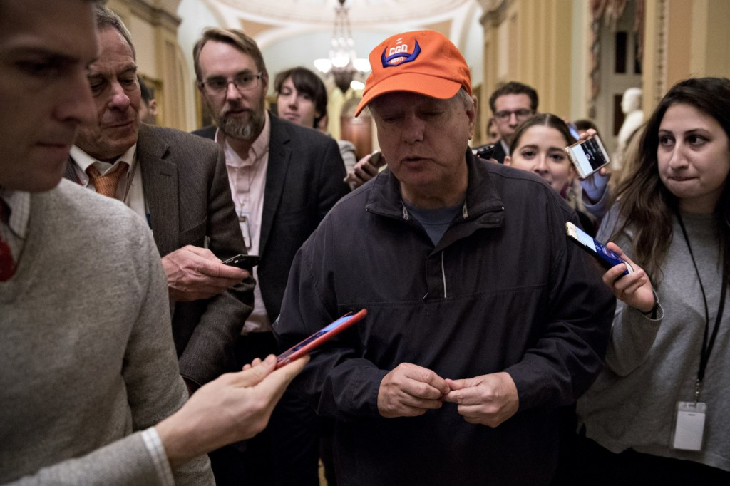 Bloomberg/Andrew Harrer
Sen. Lindsey Graham, R-S.C., speaks to members of the media at the Capitol on Sunday. Graham met with the moderates' group and has sought action on immigration legislation.