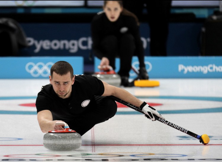 Russian curler Alexander Krushelnitsky practices ahead of the 2018 Winter Olympics in Gangneung, South Korea. Russian curlers say a coach on their team told them that mixed doubles bronze medalist Krushelnitsky tested positive for a banned substance at the Pyeongchang Olympics.