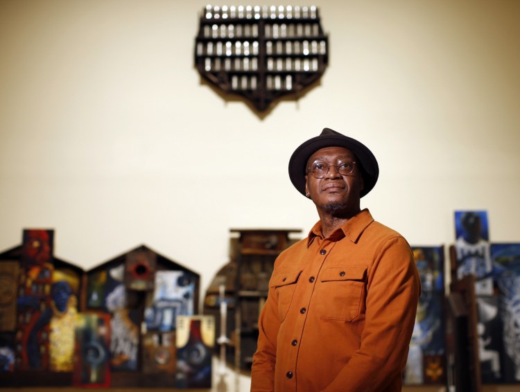 Daniel Minter's installation at the Portland Museum of Art, "A Distant Holla," is getting a lot of attention. It's a series of small pieces that tell a narrative of slavery and Minter's personal African-American experience. Top, the entire width of the piece. Below, a detail from the first section, which includes boxes, vessels and containers that represent places of safekeeping.