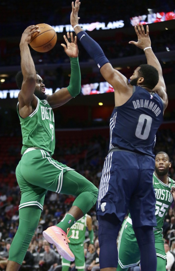 Boston Celtics guard Jaylen Brown goes to the basket against Detroit Pistons center Andre Drummond during the Celtics' 110-98 win Friday in Detroit.