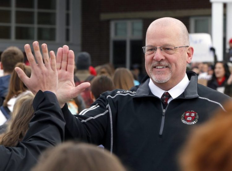 David Creech gets support from Scarborough High School students as they enter the building after this year's February vacation. Creech, who resigned as Scarborough principal effective June 30, has now been hired as interim principal at Winthrop High School.