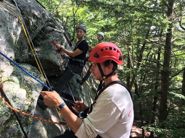 GZA Portland office engineers participate in ropes training at Pawtuckaway State Park in Nottingham, N.H. From left: Ian Mosbrucker, Erik Friede, and Sean Horan. Photo courtesy of GZA. 