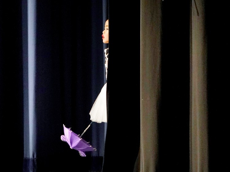 Mia Mastrogiacomo waits backstage for the start of the Doggie Dance during a Lunar New Year celebration at the Westbrook Performing Arts Center in Westbrook on Saturday. Students from the CAFAM Chinese School performed traditional dances at the celebration, which celebrated the start of the Year of the Dog.