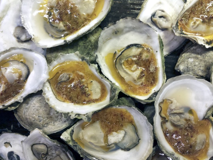 Oysters dolloped with maple-chipotle compound butter.