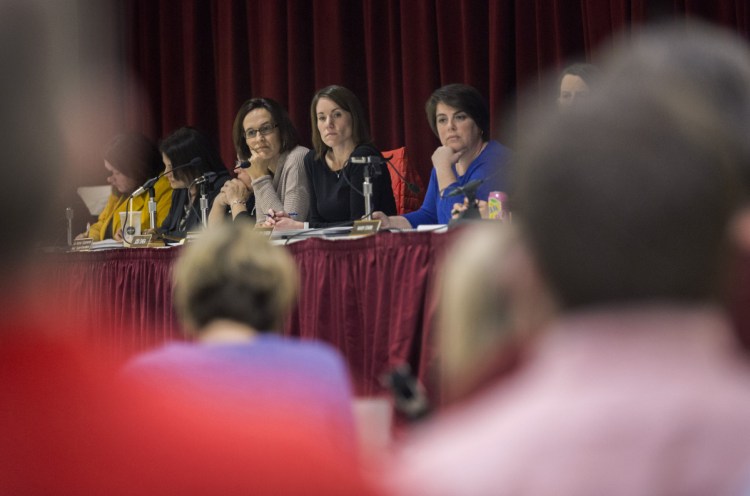 Scarborough Superintendent Julie Kukenberger, center, listens with board members Jodi Shea, left, and Hillary Durgin, right, as parents and school administrators voice their opinions during a meeting March 12 to discuss later school start times. The teachers' union has taken a vote of "no confidence" in the school board and superintendent.