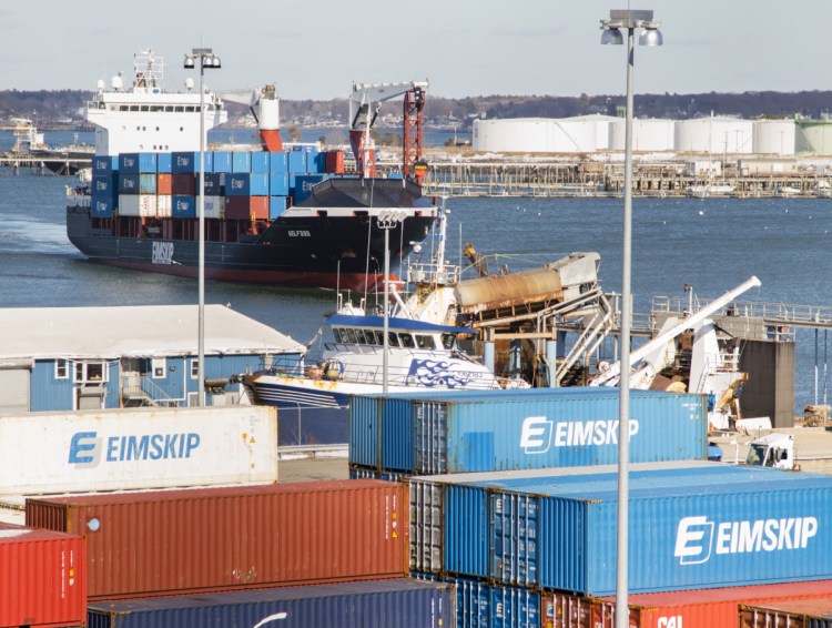 An Eimskip container ship navigates toward the International Marine Terminal on Commercial Street in Portland on Friday.