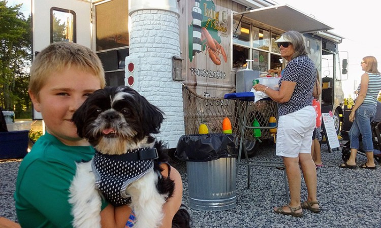 Dylan Leech and Pokey Leech enjoy the evening at Congdon's After Dark Food Truck Park in summer 2017.

