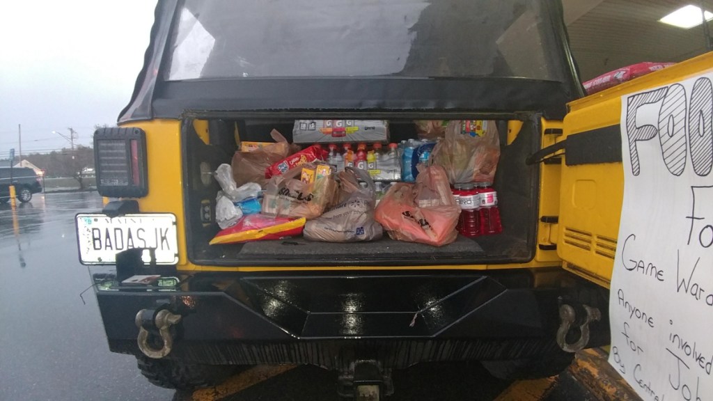 Shane Morrison and others collected donations at Shaw's Supermarket on Kennedy Memorial Drive in Waterville to take to the police officers involved in the manhunt for police-killer suspect John Williams.