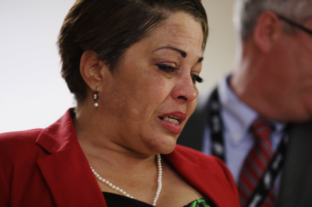 Chelan Lasha weeps as she returns to the courtroom after a recess to testify against Bill Cosby during his sexual assault retrial Wednesday in Norristown, Pa.