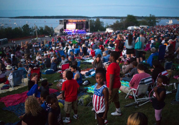 Joyce Bento, 6, wears a patriotic top as she and her family take their spot on the Eastern Promenade while the Portland Symphony Orchestra plays on July 4, 2017. The PSO won't play this year. 