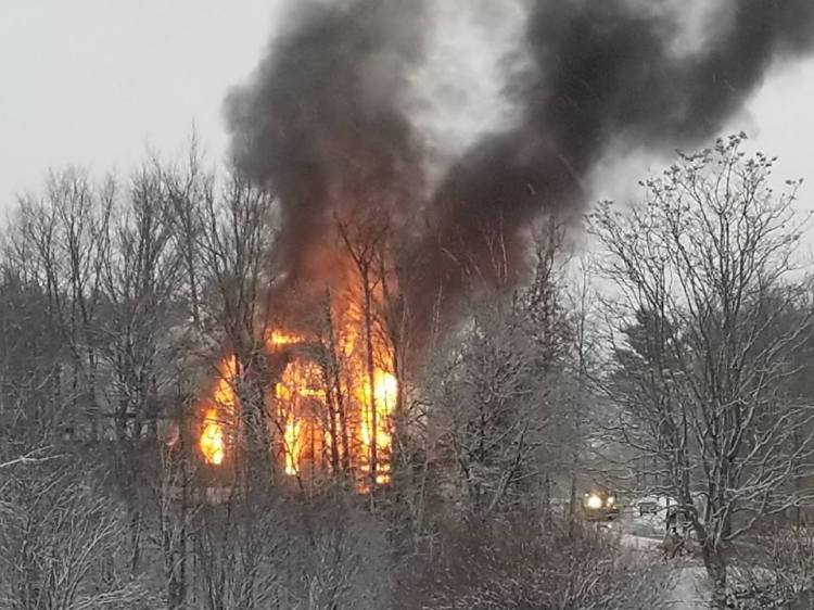 A vacant home burns at 133 North Main St. in Andover on Friday night. 