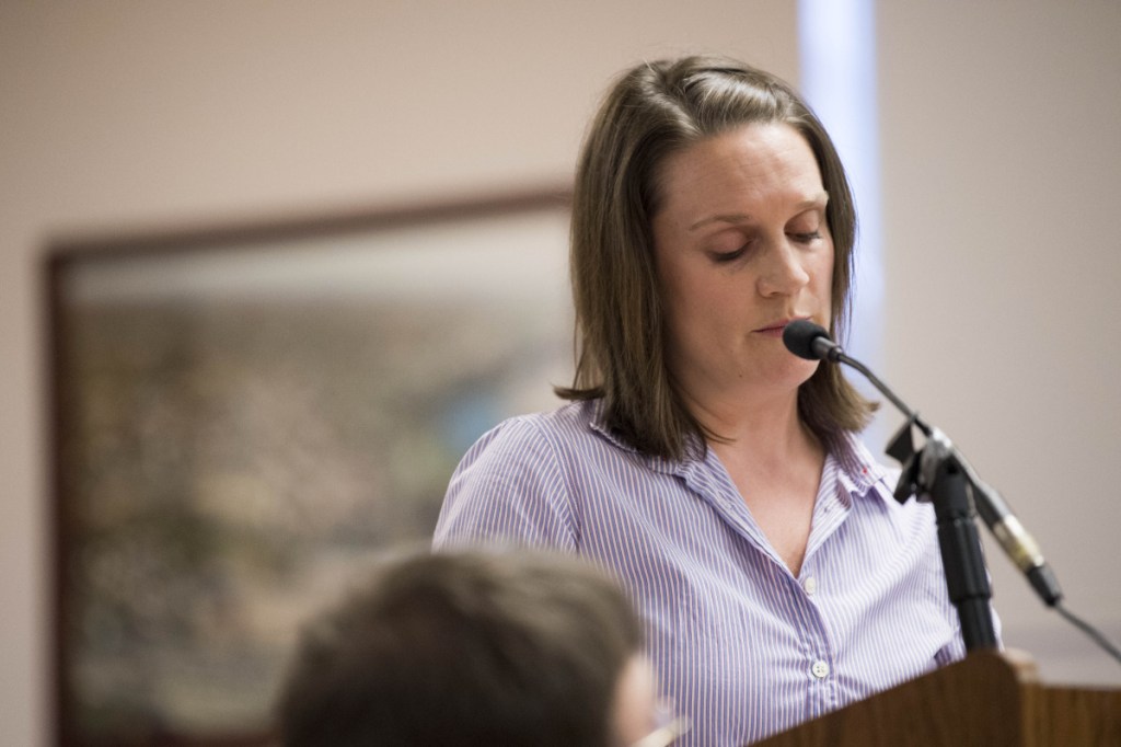 Amanda Isgro, wife of Mayor Nick Isgro, reads a prepared statement Tuesday evening at the beginning of a City Council meeting in the council chamber at The Center in Waterville. She defended her husband and blamed efforts to recall him as mayor on the Maine Democratic Party and the liberal advocacy group the Maine People's Alliance.