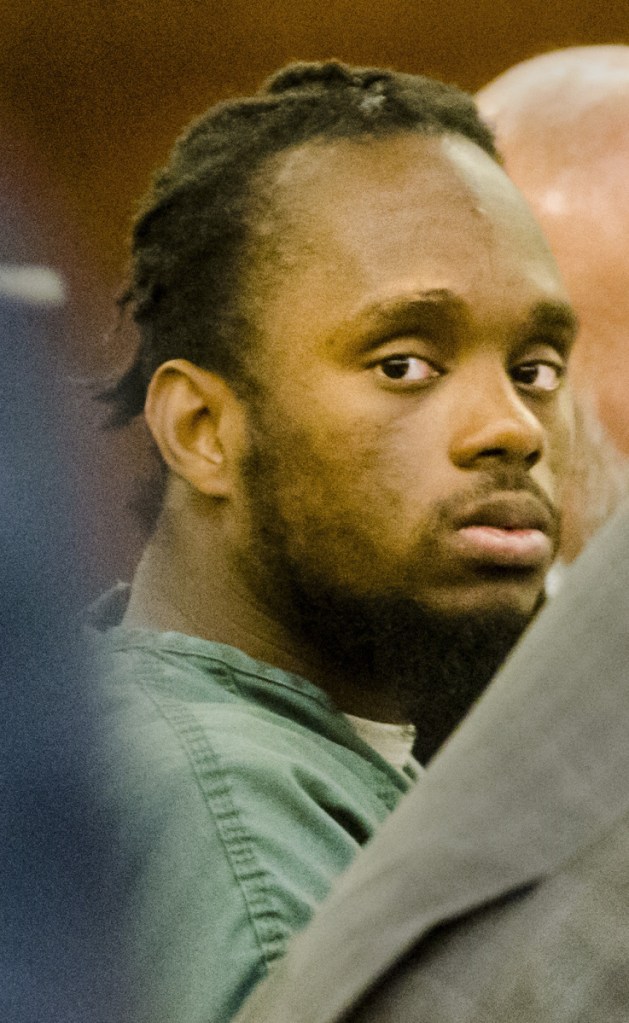 Aubrey N. Armstrong, one of four people charged in the Nov. 23, 2015, drug-related beating death of Joseph Marceau in an Augusta apartment, left, looks at his attorney, Brad Grant, during the opening day of trial Tuesday at the Capital Judicial Center in Augusta.