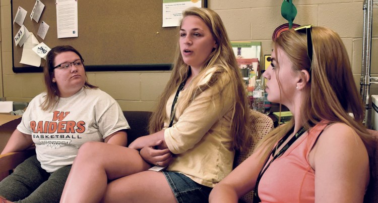 From left, Emily Glidden of Winslow High School, Alisa Bonefant of Hall-Dale and Bradie Reynolds of Mt. Blue discuss the weeklong college-level classes they took through a program sponsored by Jobs for Maine's Graduates, Thomas College and the Harold Alfond Foundation.