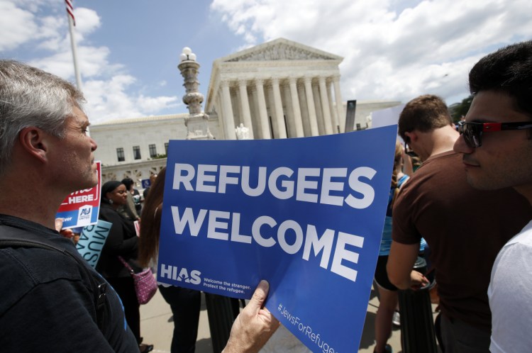 Critics protest the ruling upholding President Trump's travel ban in front of the Supreme Court on Tuesday. The decision will long be a stain on our country's moral conscience, a letter writer says.