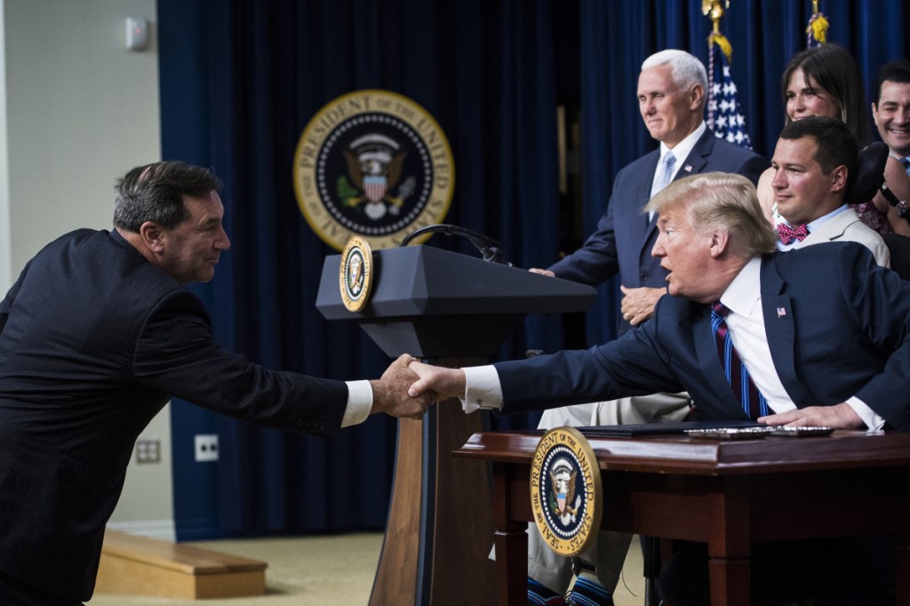 Sen. Joe Donnelly, D-Ind., left, will face pressure to approve President Trump's Supreme Court nominee as he campaigns for re-election.