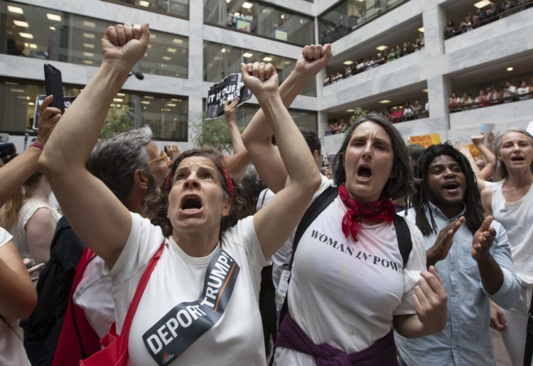 Hundreds of activists protest the Trump administration's approach to illegal border crossings and separation of children from immigrant parents, in the Hart Senate Office Building on Capitol Hill in Washington, D.C., on Thursday.