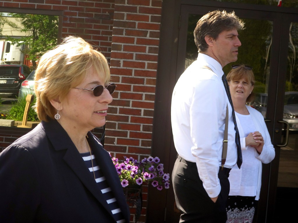 Maine Attorney General Janet Mills, left, one of seven Democrats in the gubernatorial primary, greets voters outside a polling place Tuesday in Portland.