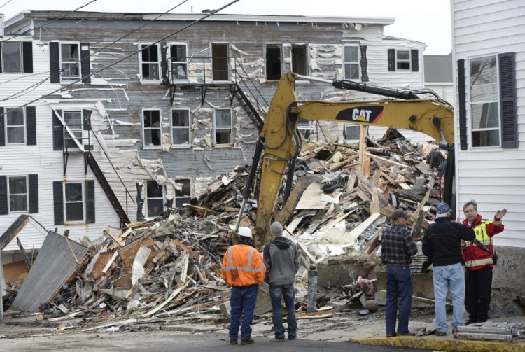 Rubble is all that is left of an apartment building on Hill Street in Biddeford after a fire in April that killed one man. An operator of a sober house had filed a federal complaint after the city deemed the building inappropriate for use as a sober house because it had no sprinkler system. The complaint has been withdrawn.  