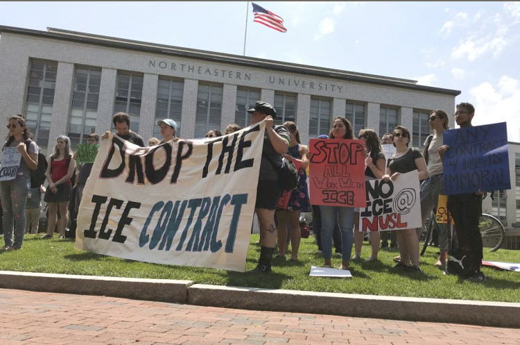 Students and community activists rally at Northeastern University on  Wednesday demanding the school cancel a multimillion-dollar research contract with U.S. Immigration and Customs Enforcement. 