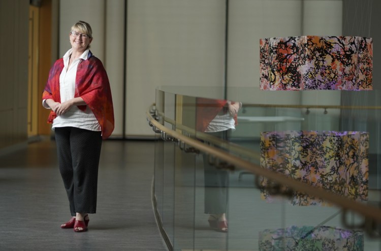 Deborah Bronk, president and CEO of the Bigelow Laboratory for Ocean Sciences in East Boothbay, photographed on Tuesday, July 17, 2018. The artwork at right is 'Fantastic Empiricism: The Science of Mesocosms and the Expression of Light' by artist-in-residence Carter Shappy.