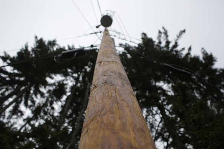 A new, stouter utility pole on Harpswell's Firehouse Road replaces one of the hundreds across Maine that were downed in an October 2017 wind and rain storm. Central Maine Power's parent company is preparing a multimillion plan to harden its power distribution system against storms.