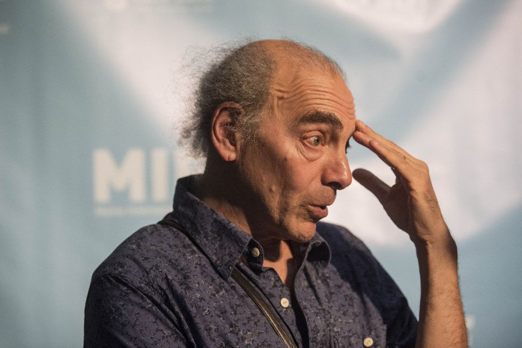 Ken Eisen, programmer of the Maine International Film Festival, speaks with a reporter Friday outside the theater at the Waterville Opera House in Waterville. MIFF kicked off Friday night with a showing of "The Bookshop."