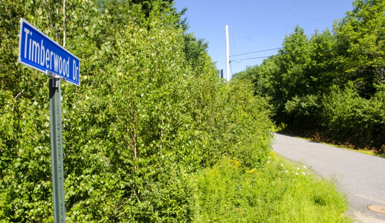 Photo taken on Aug. 10 shows the intersection of Timberwood Drive and Route 201 in Gardiner, where a Massachusetts man shot himself to death in front of police officers the previous evening, and where a Massachusetts woman's body was found in the trunk of the car he was driving.