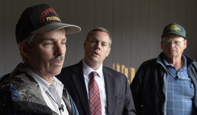 Litchfield Fair President Charlie Smith, left, attorney Kevin Sullivan and Vice President Richard Brown assert Wednesday that the Litchfield Farmers' Club is missing $80,000 that should be in its accounts at this time of year. The agricultural exhibition fair, which is scheduled to run Sept. 7-9 and has been existence for 150 years, is broke, Smith said from the Pulling Ring in Litchfield.