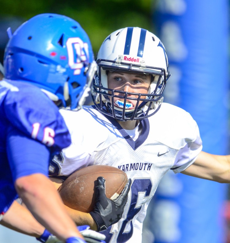 Yarmouth running back Camden Miller looks for room to run against Oak Hill High on Saturday in Wales.