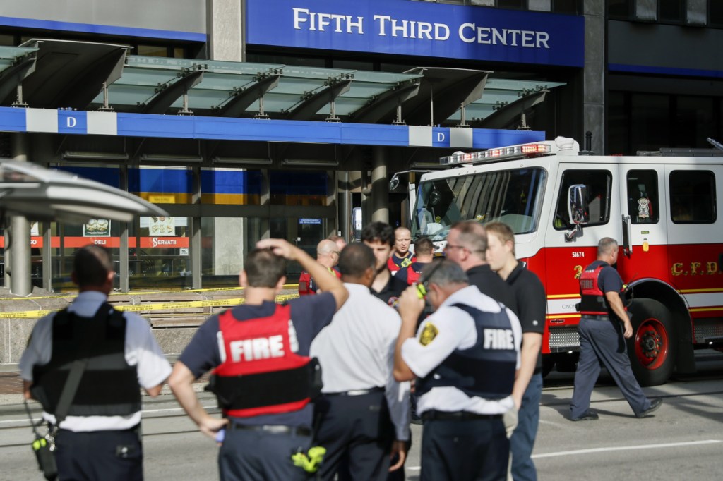 Emergency personnel and police respond to reports of an active shooter situation near Fountain Square, Thursday, Sept. 6, 2018, in downtown Cincinnati. Associated Press/John Minchillo