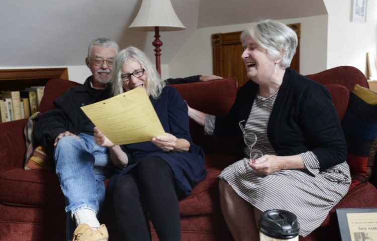 Jim and Agnes Bushell, with Marcia Brown, chuckle over old correspondence from what is now the Maine Arts Commission as they reminisce about their long-ago Portland press, Littoral Books.