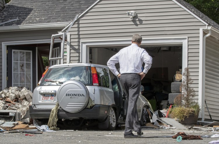 Massachusetts Gov. Charlie Baker tours 35 Chickering St., where a young man was killed during a gas explosion in Lawrence, Massachusetts, on Friday. Investigators said Saturday that there doesn't appear to be "anything nefarious, anything suspicious, anything intentional" about the destructive blasts and fires in three communities on Thursday.