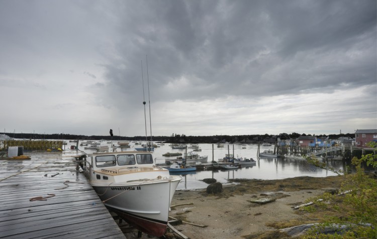 The lobster boat Apparition II is tied up at Sea Pier on the east side of Boothbay Harbor on Sept. 6. The town in 1987 rezoned the east side as a maritime district to keep the waterfront intact. Town officials are revisiting the area's zoning ordinances, which may pave the way for Paul Coulombe to build new hotels and shops. 