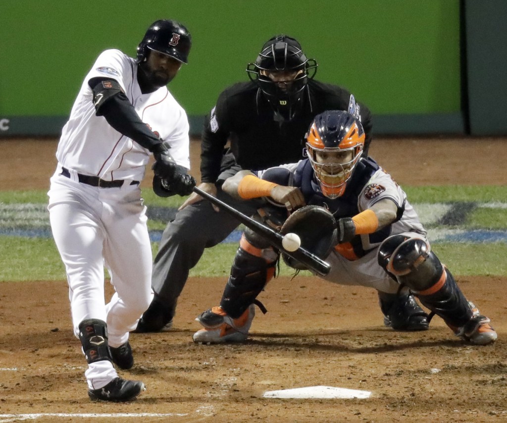 Boston's Jackie Bradley Jr. hits a three-run double in the third inning Sunday night in Game 2 of the AL Championship Series against the Astros.