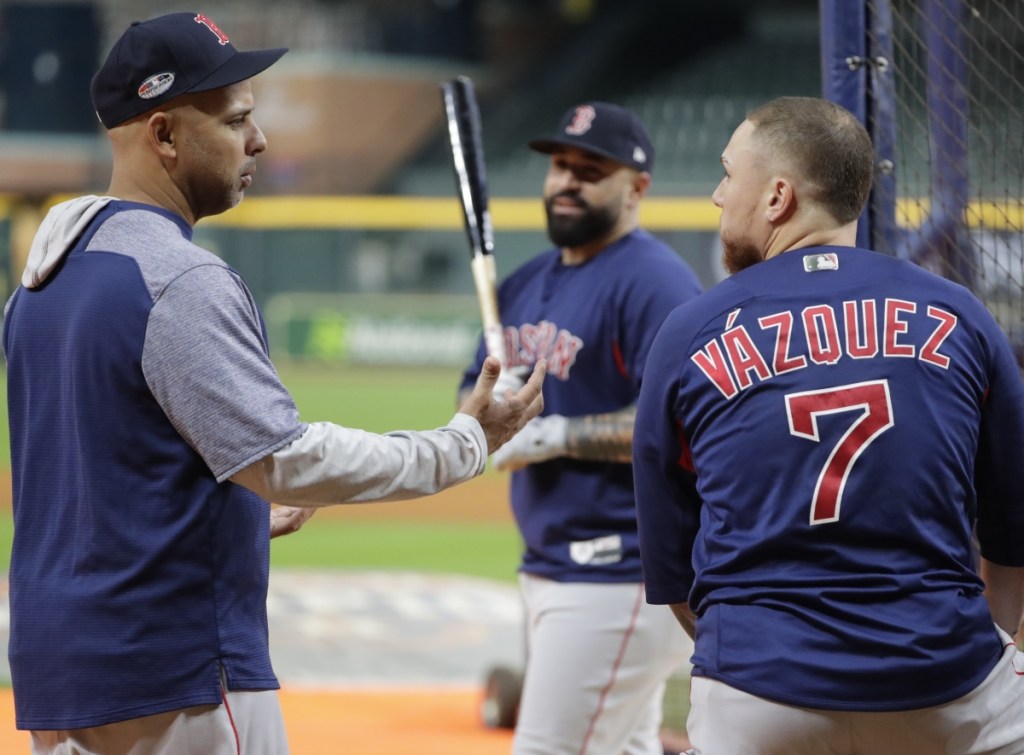 Red Sox Manager Alex Cora, left, with Christian Vazquez, right, and Sandy Leon in Houston, said he'll talk to Chris Sale before deciding on Sale's status.