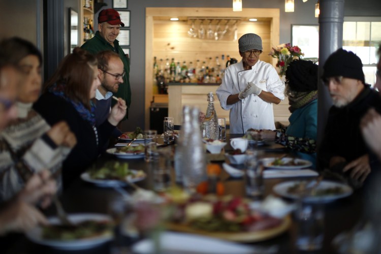 Marilou Ranta, chef at The Quarry, and her husband, William Ranta, at left, serve lunch to artists in residence at nearby Monson Arts, a project of the Libra Foundation.