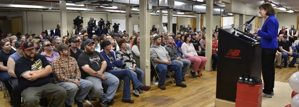 U.S. Sen. Susan Collins, R-Maine, addresses New Balance Shoe employees after a tour of their facility with Sen. Angus King, I-Maine, and Rep. Bruce Poliquin, R-2nd District, on Tuesday in Norridgewock after it was announced the company's athletic shoes were being shipped to the Department of Defense.