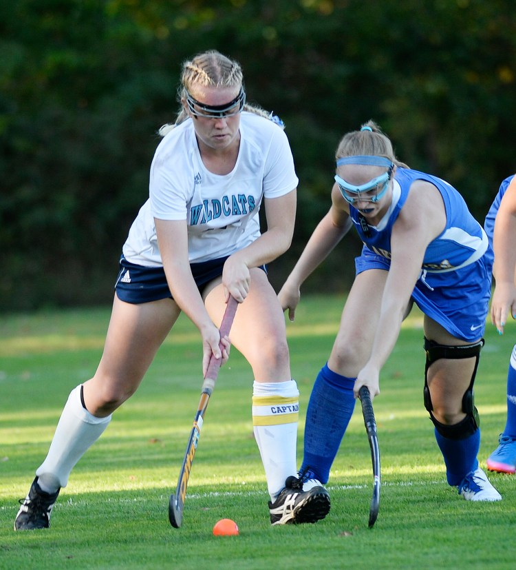 York's Emlyn Patry tries to control the ball away from Lake Region's Kaitlyn Plummer.