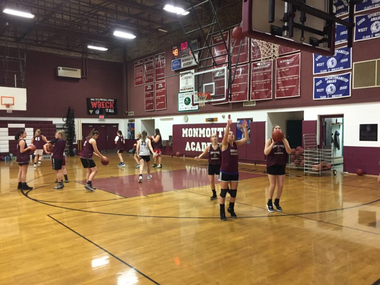 Members of the Monmouth girls basketball team work through a drill during practice Monday night in Monmouth.