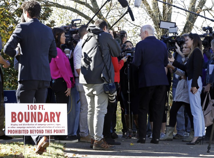 Former Gov. Phil Bredesen is interviewed past the 100-foot polling place boundary after voting Tuesday in Nashville, Tenn. Bredesen is running against Rep. Marsha Blackburn, R-Tenn., for the U.S. Senate.